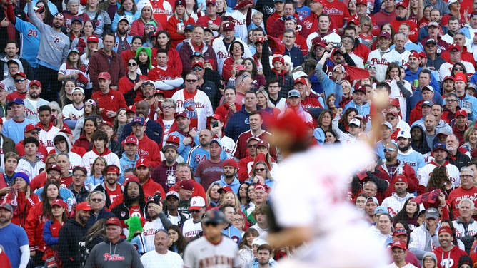 Philadelphia Phillies fans watch as Aaron Nola pitches in the first inning against the Arizona Diamondbacks during Game Six of the NLCS.