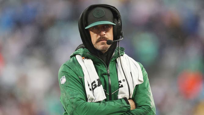Aaron Rodgers of the New York Jets looks on from the sidelines.