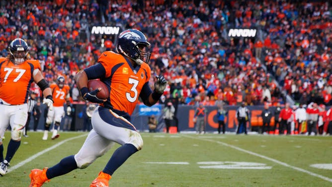 Broncos QB Russell Wilson scrambles against the Kansas City Chiefs at Empower Field at Mile High in Denver, Colorado.