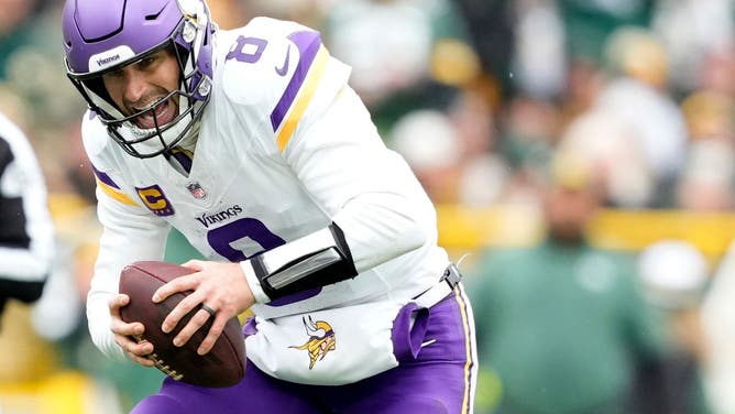 Kirk Cousins of the Minnesota Vikings is injured during a game against the Green Bay Packers.
