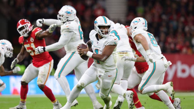Miami Dolphins QB Tua Tagovailoa rolls out of the pocket against the Kansas City Chiefs at Deutsche Bank Park in Frankfurt, Germany.