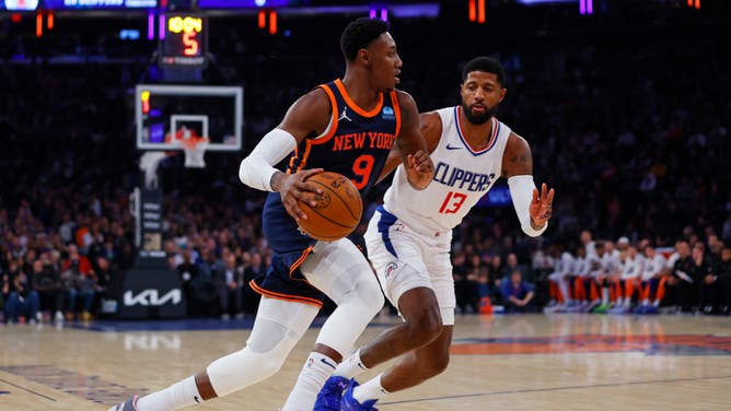 New York Knicks wing RJ Barrett drives to the hoop against Los Angeles Clippers wing Paul George at Madison Square Garden.