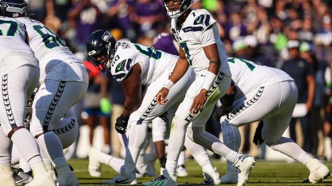Seattle Seahawks QB Geno Smith calls a play at the line of scrimmage vs. the Ravens at M&T Bank Stadium in Baltimore, Maryland.