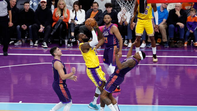 LeBron James gets to the rack a shot vs. the Suns during the NBA In-Season Tournament at Footprint Center in Phoenix, Arizona.