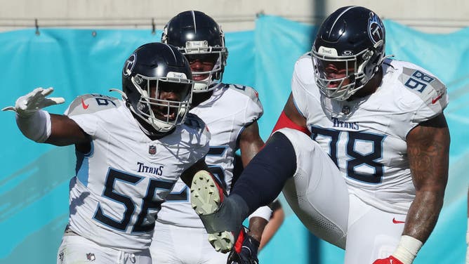 Monty Rice and Jeffery Simmons of the Tennessee Titans celebrate in the second quarter against the Jacksonville Jaguars.
