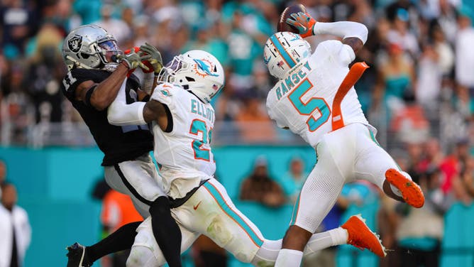 Dolphins CB Jalen Ramsey intercepts a pass against the Las Vegas Raiders in NFL Week 11 at Hard Rock Stadium in Miami.