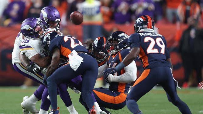 Kareem Jackson of the Denver Broncos delivers a vicious blow to the head of Minnesota Vikings quarterback Joshua Dobbs.