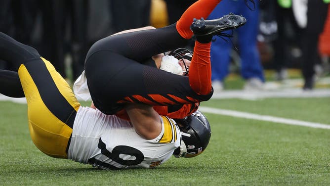 Pittsburgh Steelers LB T.J. Watt sacks Bengals QB Jake Browning in an NFL game at Paycor Stadium in Cincinnati, Ohio.
