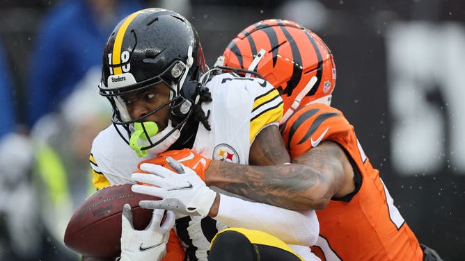 Diontae Johnson of the Pittsburgh Steelers fails to keep possession of the ball during the first quarter of a game against the Cincinnati Bengals.
