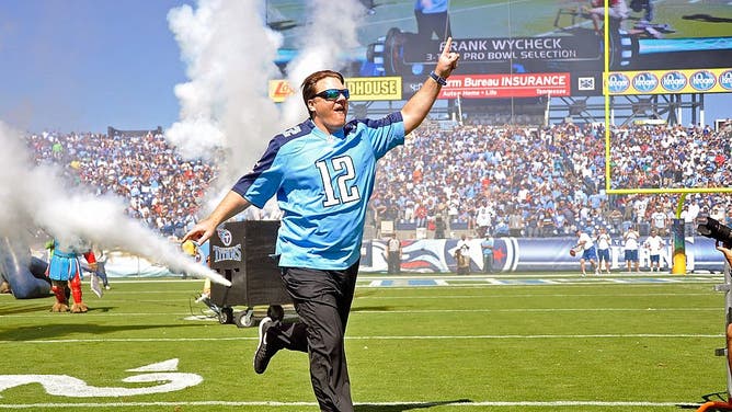 Former tight end Frank Wycheck of the Tennessee Titans runs onto the field prior to a game between the Tennessee Titans and the San Diego Chargers at LP Field on September 22, 2013 in Nashville, Tennessee.
