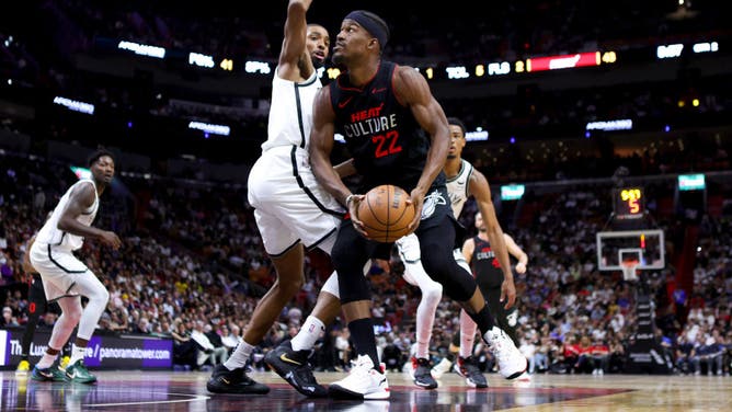 Heat wing Jimmy Butler attacks the paint against Brooklyn Nets wing Mikal Bridges at Kaseya Center in Miami.