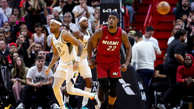 Heat wing Jimmy Butler reacts after a basket vs. the Indiana Pacers at Kaseya Center in Miami.