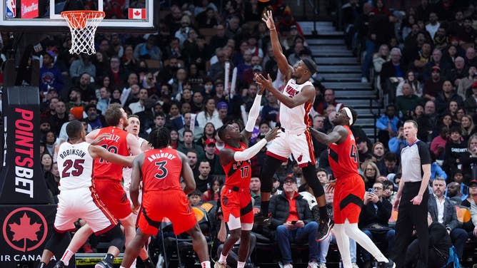 Miami Heat wing Jimmy Butler shoots a floater on the Raptors during an NBA basketball game at the Scotiabank Arena in Toronto, Ontario, Canada.