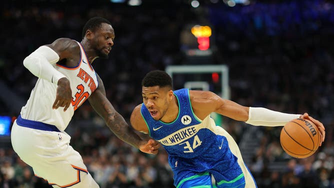 Bucks PF Giannis Antetokounmpo attacks the paint on New York Knicks PF Julius Randle during the NBA In-Season Tournament Quarterfinal at Fiserv Forum in Milwaukee, Wisconsin.