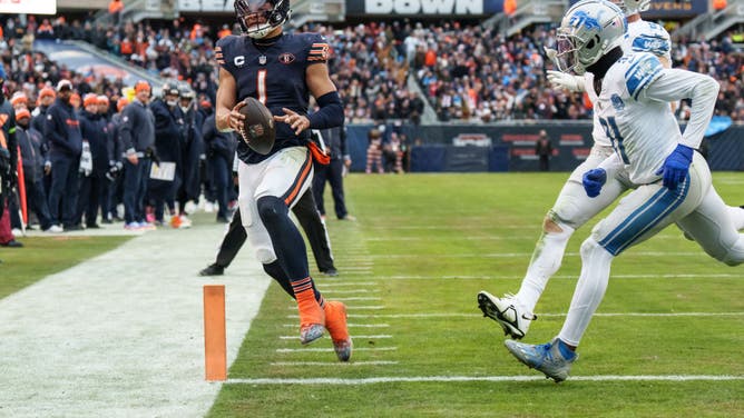 Bears QB Justin Fields runs for a TD vs. the Detroit Lions in NFL Week 14 at Soldier Field in Chicago.