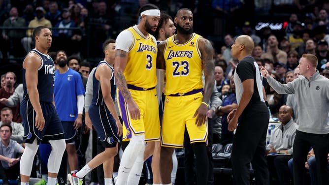 Los Angeles Lakers big Anthony Davis and LeBron James during a timeout vs. the Mavericks at American Airlines Center in Dallas.