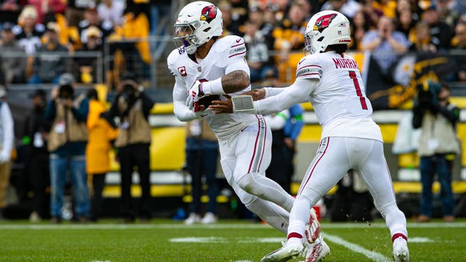 Arizona Cardinals QB Kyler Murray hands it off to RB James Conner vs. the Steelers at Acrisure Stadium in Pittsburgh, Pennsylvania.