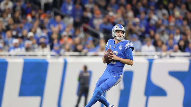 Lions QB Jared Goff drops back to pass against the Denver Broncos in an NFL Week 15 game at Ford Field in Detroit, Michigan.