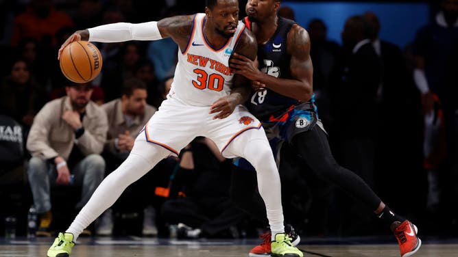 New York Knicks PF Julius Randle backs down Nets PF Dorian Finney-Smith at Barclays Center in Brooklyn.