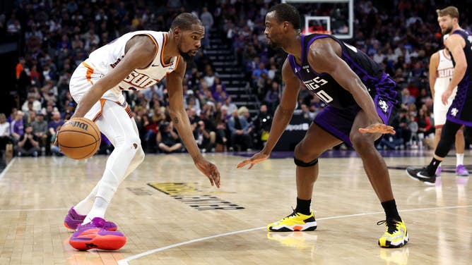 Phoenix Suns All-Star Kevin Durant makes a move on Kings SF Harrison Barnes at Golden 1 Center in Sacramento, California.