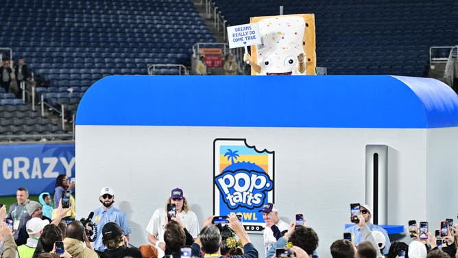 The Pop-Tarts mascot is lowered into a toaster following the 2023 Pop-Tarts Bowl between the Kansas State Wildcats and the NC State Wolfpack at Camping World Stadium in Orlando, Florida.