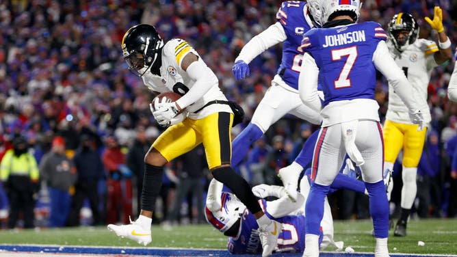 Diontae Johnson of the Pittsburgh Steelers catches a touchdown pass against the Buffalo Bills during the NFL Wild Card round.