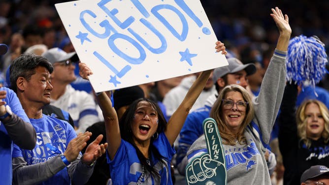 A Detroit Lions fan holds a sign reading “Get Loud!” during an NFL wild-card playoff football game against the Los Angeles Rams at Ford Field on January 14, 2024 in Detroit, Michigan.