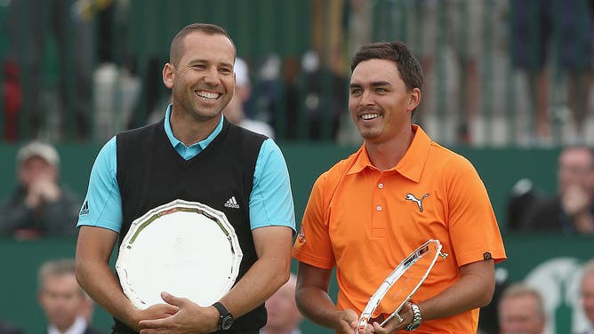 Sergio Garcia and Rickie Fowler stand with their awards for joint second place after the final round of The 143rd Open Championship at Royal Liverpool on July 20, 2014 in Hoylake, England.