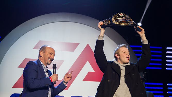 EA Sports COO Peter Moore awards the Madden Challenge Championship belt to Serious Moe. ESPN is promoting an entire week of programming dedicated to the release of the upcoming video game.