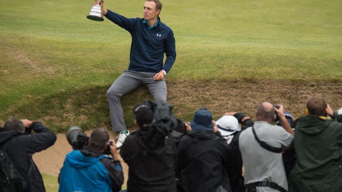 Jordan Spieth poses for pictures with the Claret Jug after winning the 2017 British Open Golf Championship at Royal Birkdale in England.