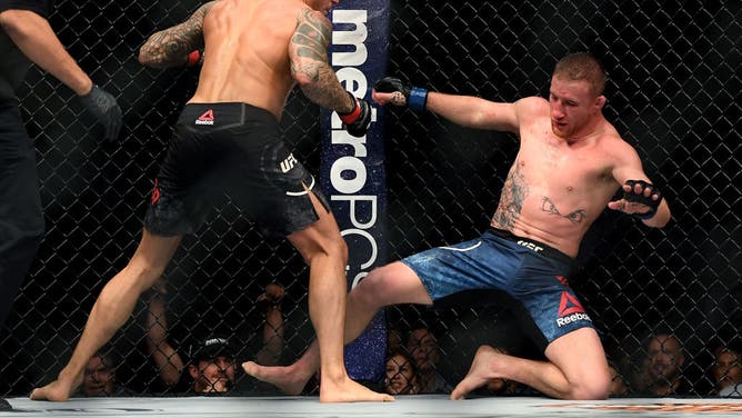 Dustin Poirier defeats Justin Gaethje in their lightweight fight during the UFC Fight Night event at Gila River Arena in Glendale, Arizona.
