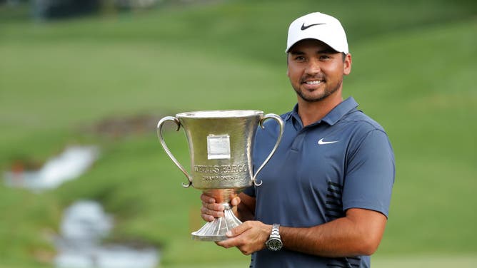 Jason Day poses with the trophy after winning the 2018 Wells Fargo Championship at Quail Hollow Club in Charlotte, North Carolina.