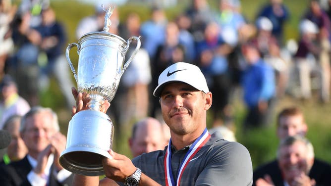 Brooks Koepka of the United States celebrates with the winners trophy after the final round of the 2018 U.S. Open.