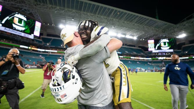 Georgia Tech head coach Geoff Collins celebrates with his players after defeating Miami, Mario Cristobal Courtesy of Georgia Tech Football