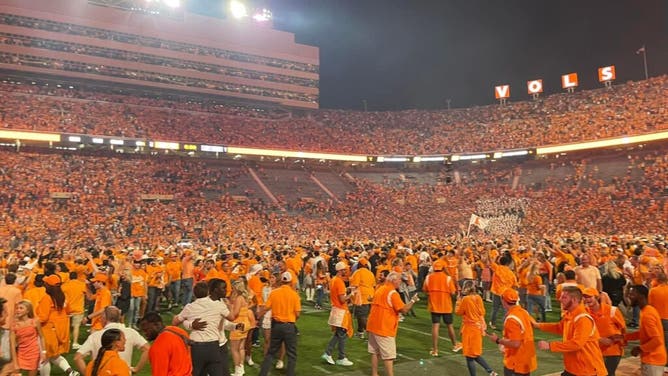 Tennessee fans storm the field following the 2022 win over Alabama, which Jermaine Burton was also in the postgame headlines