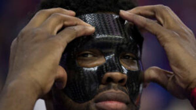 Joel Embiid puts on face mask
