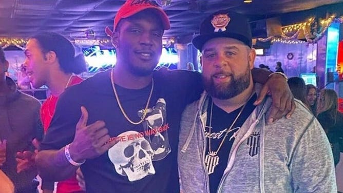 Ex-UFC fighter Karl Roberson, left, takes photo with Ryan Leonard. Roberson was charged with home burglary after allegedly robbing Leonard of $200,000 worth of jewelry.