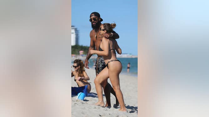 Michael Jordan's son, Marcus, enjoys himself with Scottie Pippen's ex-wife, Larsa, on Miami Beach.