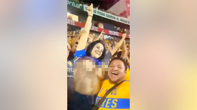Mexican Soccer fan flashes crowd after goal