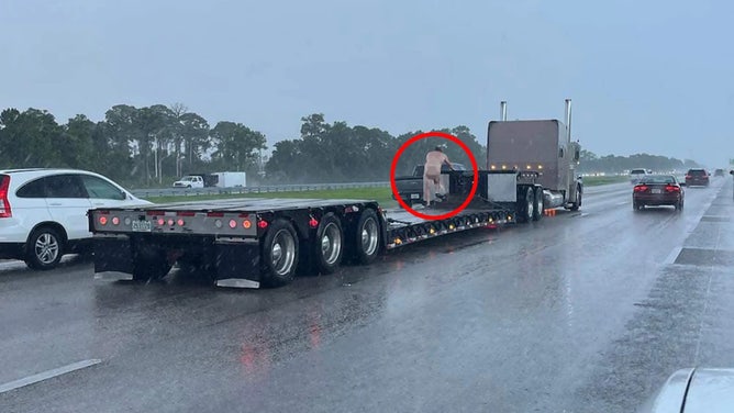 Naked Florida man out for a ride in the rain on I-75