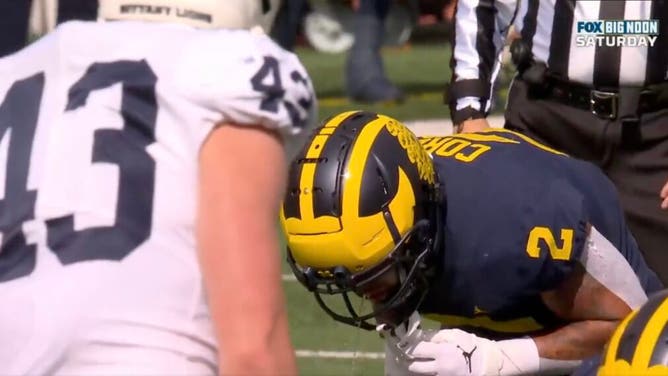 Michigan RB Blake Corum vomits prior to the snap on a third down play.