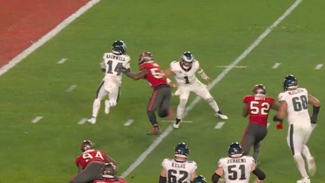Eagles QB Jalen Hurts attempts to block Buccaneers All-Pro LB Lavonte David with just his right arm.