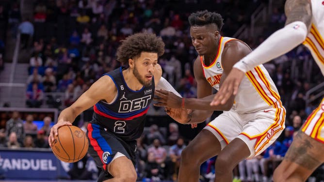 Pistons PG Cade Cunningham drives to the basket on Atlanta Hawks big Clint Capela at Little Caesars Arena in Detroit.