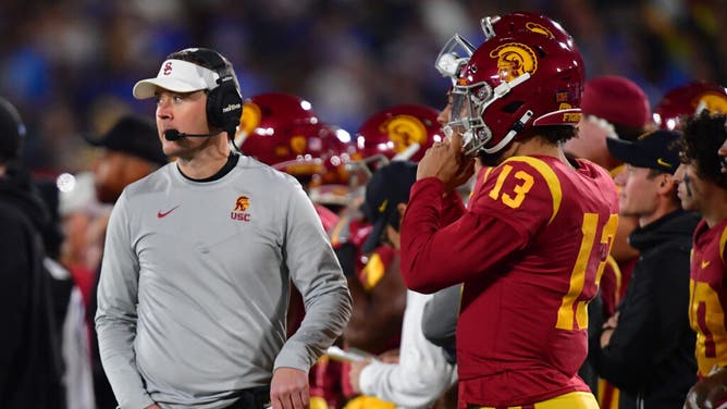 USC Trojans head coach Lincoln Riley and QB Caleb Williams talk strategy against the UCLA Bruins during the first half at the Rose Bowl.