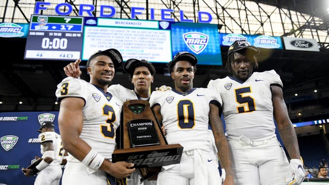 The Toledo Rockers celebrating with the MAC Championship trophy after beating Ohio University at Ford Field in Detroit.