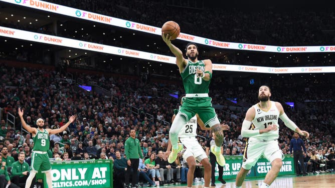 Celtics SF Jayson Tatum takes a layup on the New Orleans Pelicans in an NBA game at TD Garden in Boston.