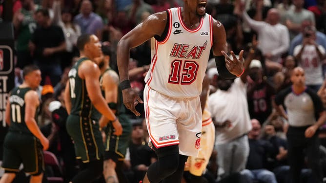 Miami Heat C Bam Adebayo reacts after making a shot against the Boston Celtics during the second half at Miami-Dade Arena.