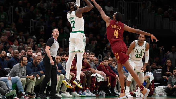 Celtics All-Star Jaylen Brown shoots over Cleveland Cavaliers big Evan Mobley at TD Garden in Boston.
