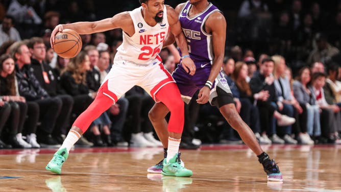 Nets combo guard Spencer Dinwiddie keeps the ball away from Sacramento Kings PG De'Aaron Fox at Barclays Center in Brooklyn.