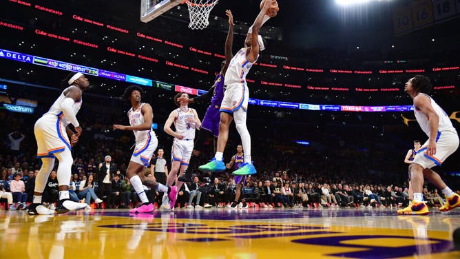 Oklahoma City Thunder PG Shai Gilgeous-Alexander grabs a rebound against the Lakers at Crypto.com Arena in Los Angeles.